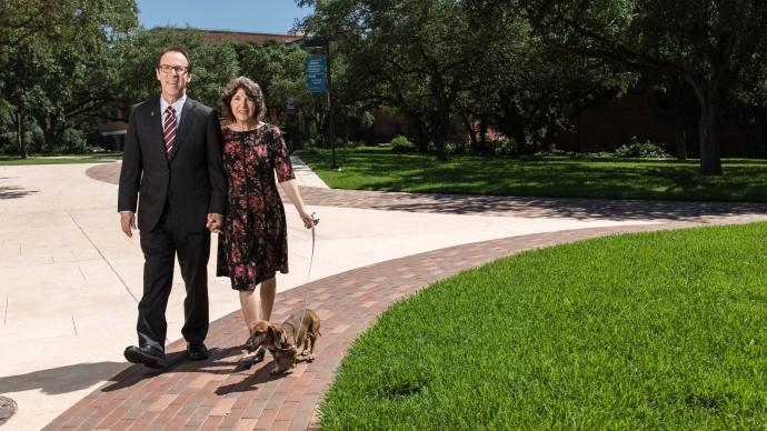 Kimberly and Danny Anderson walk their dog by the Magic Stones