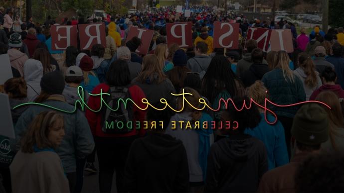 A shot of the INSPIRE banner at the MLK March is superimposed with the words "Juneteenth: Celebrate Freedom Day"