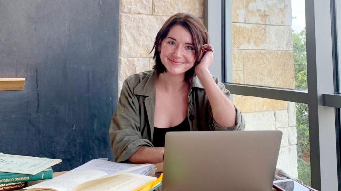 Rachel Kaufman sits in a CSI study lounge with her computer