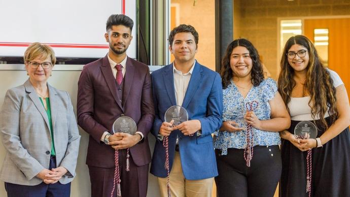 Award recipients stand with President Beasley at the 2023 Student Leadership and Service Awards ceremony.