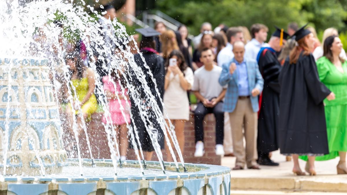 Students and families around miller fountain for commencement