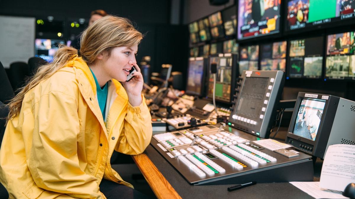 Student sitting at the television media station.